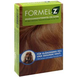 Grüne Verpackung eines Ergänzungsfuttermittels für Hunde mit einem Hund und rotem Fell.